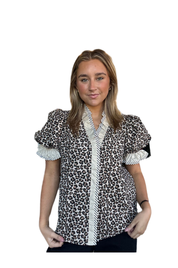 Leopard print blouse with short puff sleeves and snap closures