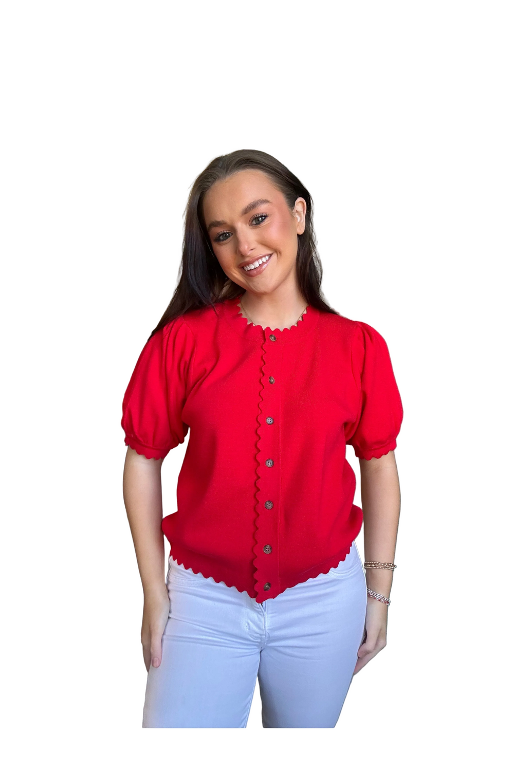 woman wearing a short sleeve red cardigan with scalloped edges