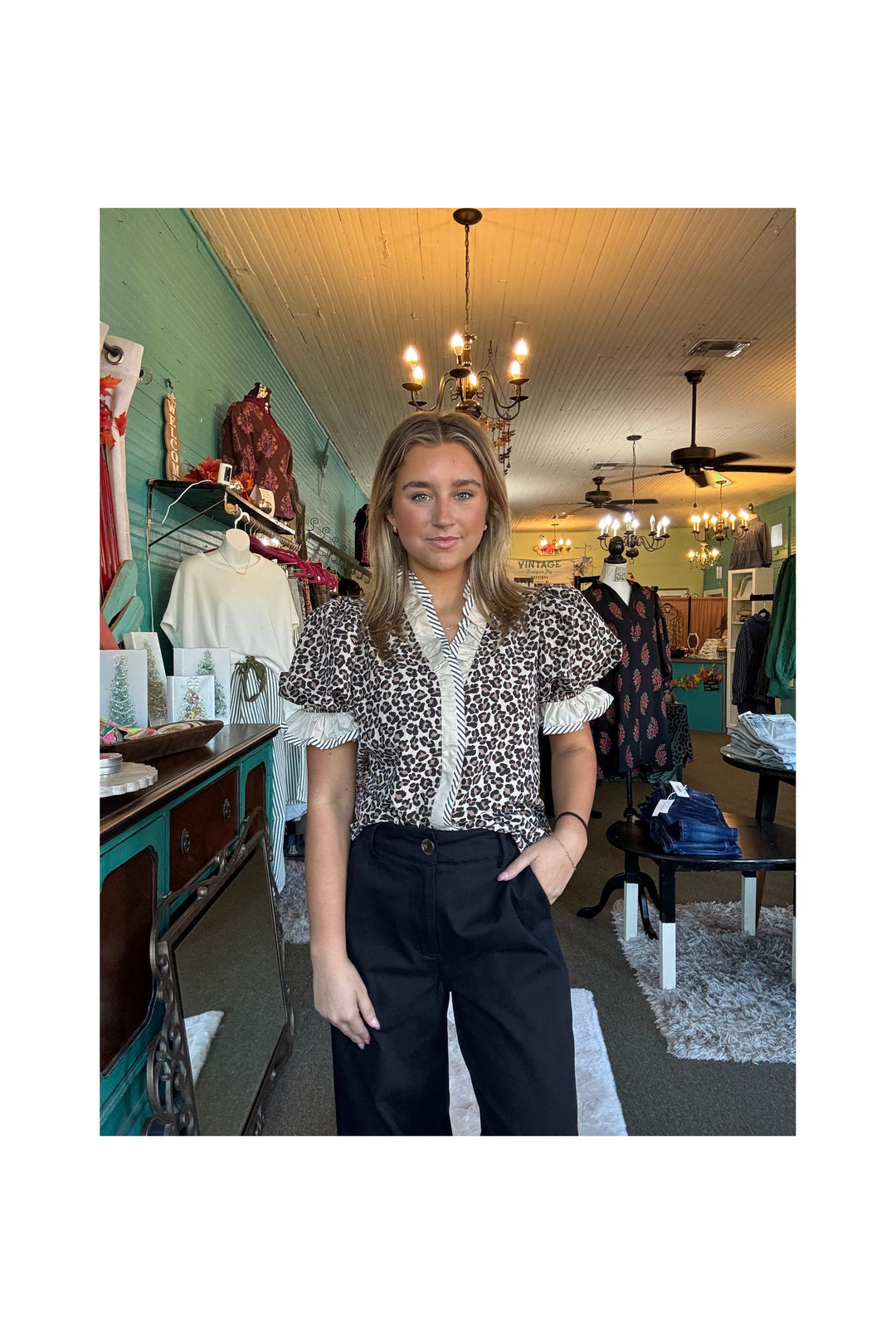Leopard print blouse with short puff sleeves and snap closure
