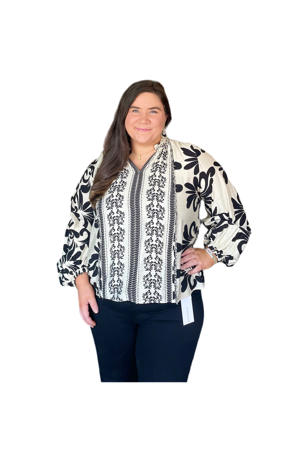 Woman wearing a patterned blouse with a white background