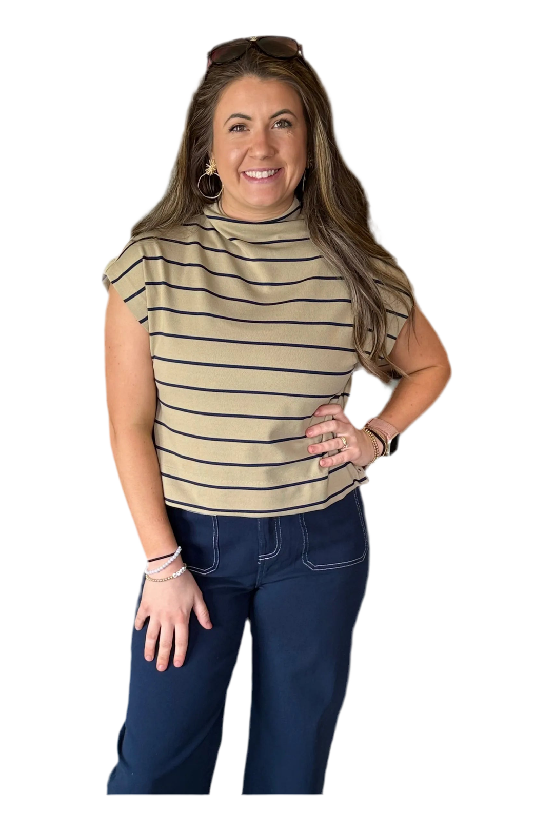Woman wearing a striped shirt and blue pants on a white background