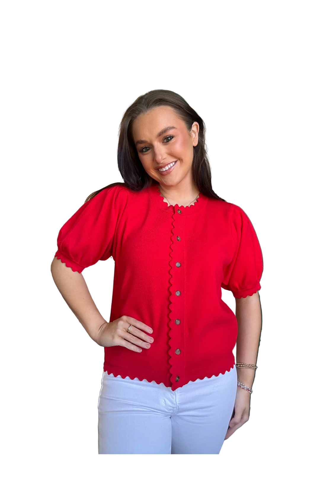 Woman wearing a red scalloped cardigan