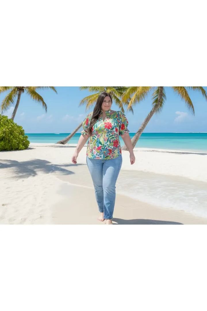 Woman wearing a colorful floral blouse in a store setting