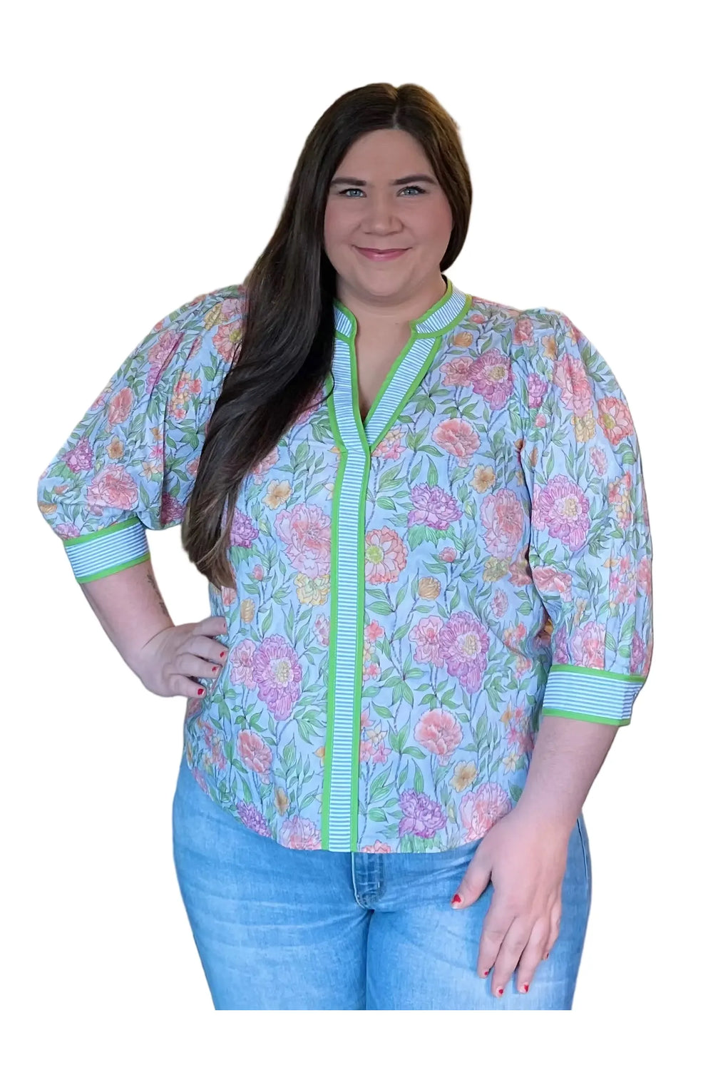 Woman wearing a floral 3/4 sleeve blouse
