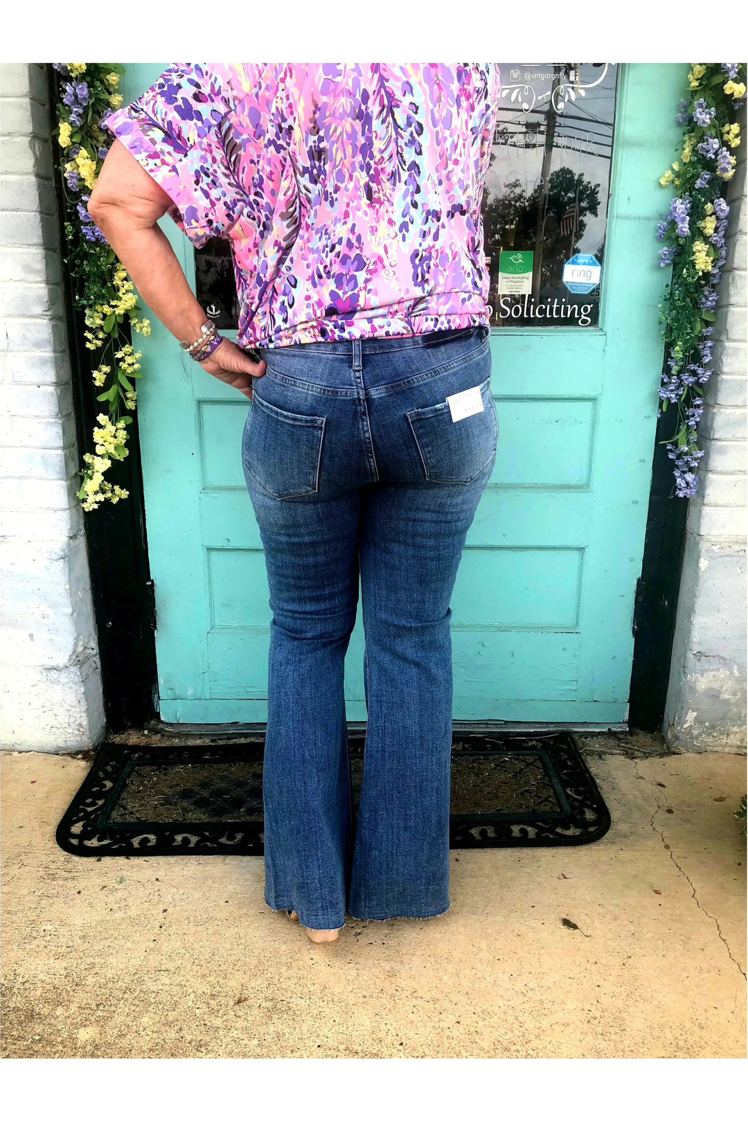 Medium Wash High Rise Twisted Hem Distressed Flare Jeans-Bottoms-Risen-Vintage Dragonfly-Women’s Fashion Boutique Located in Sumrall, Mississippi